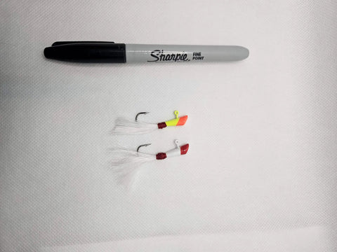 Two shad darts fishing lures with bucktail next to a Sharpie for scale, part of the Shad Darts Fishing Lures Kit 25 Pack With One Eighth Oz Jig Heads And Bucktail Assorted 5 Colors Perfect For Crappie American Shad Bass Walleye Panfish Realistic Swimming Action And Bright Paint.