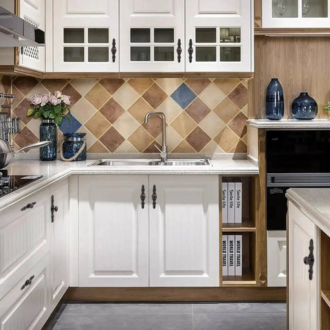 White kitchen cabinets with oil rubbed bronze knobs and back plates, featuring a slick rustic design for practical and decorative use.