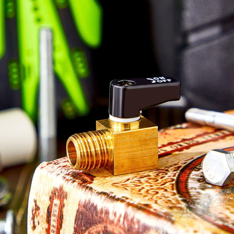 Brass air compressor valve with black ON/OFF lever, 1/4 in NPT male threads, mounted on brass block.