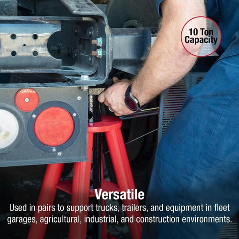 Mechanic placing vehicle on 10 Ton Pin Type Jack Stands High Height Pair With Four Leg Steel Base