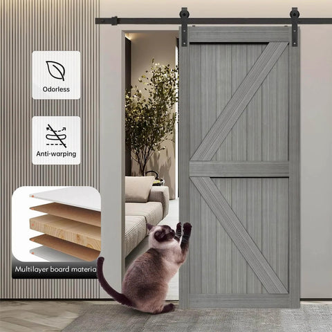 32x84 Inch MDF Light Gray Barn Door with 6.6 Ft Sliding Hardware Kit installed in a living room with visible layering and a cat nearby
