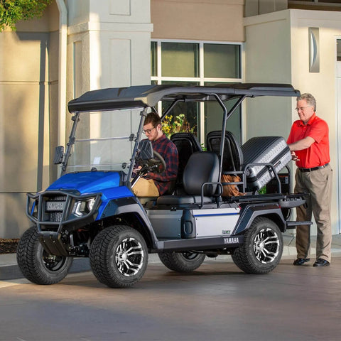 Four 205/50-10 Golf Cart Wheels And Tires Set With 10 Inch Aluminum Alloy Rims installed on a blue golf cart, Yamaha model.
