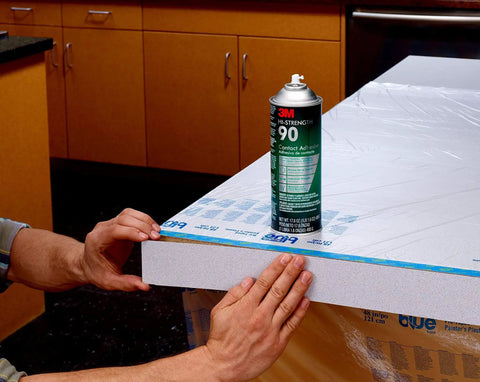 Hi-Strength Spray Adhesive 90, Low VOC 14.6 oz can on wood surface, showing application and bonding capability, CARB compliant.