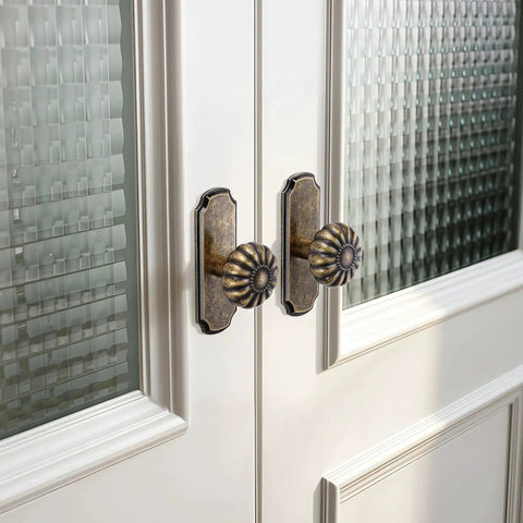Vintage Antique Brass Cabinet Knobs With Backplates 8 Pack Drawer Pulls installed on glass-paneled cabinet doors