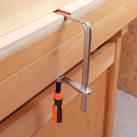 Track F Clamp For 3/8 x 3/4 Double Cut T-Track, 6 Inch Opening, heavy duty, attached to a wooden bench for woodworking use