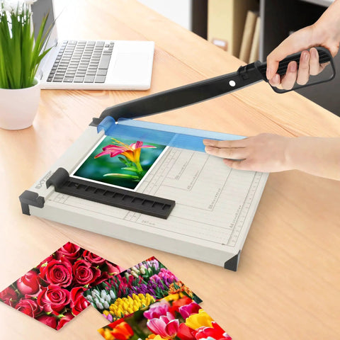 Heavy Duty 12 Inch Guillotine Paper Cutter With Safety Guard, Magnetic Guide, And Laser Printed Scale in use on a desk