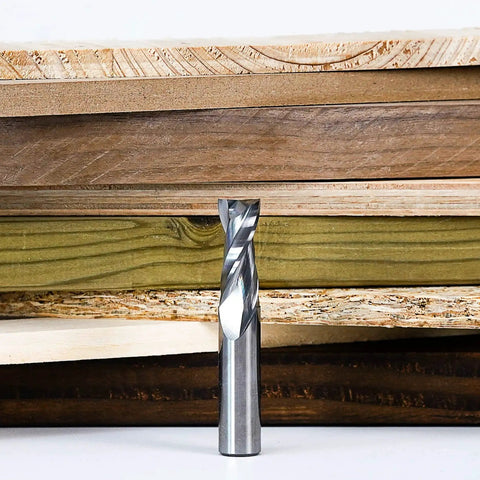 Upcut Spiral CNC Router Bit With Half Inch Shank And Half Inch Cutting Diameter HRC55 Solid Carbide in front of wood planks