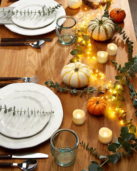 Flickering LED Tea Lights 24Pcs Battery Operated For Votive Centerpieces on dining table with fall decorations