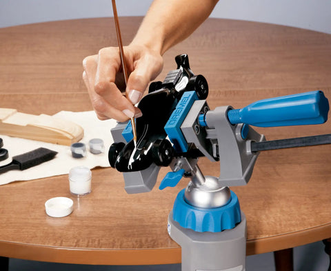 3 in 1 Multi Vise Attachment for Dremel Rotary Tool Stationary Vise holding small craft piece on wooden table