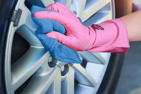 Blue 12x14 Inch Shop Towels Pack Of 50 Plus 5 Bonus Reusable Cleaning Rags For Garage Auto Painting Kitchen Bar Tough As Nails 100 Percent Cotton Absorbent Towels Workhorse being used to clean a car wheel, showing absorbency and durability.