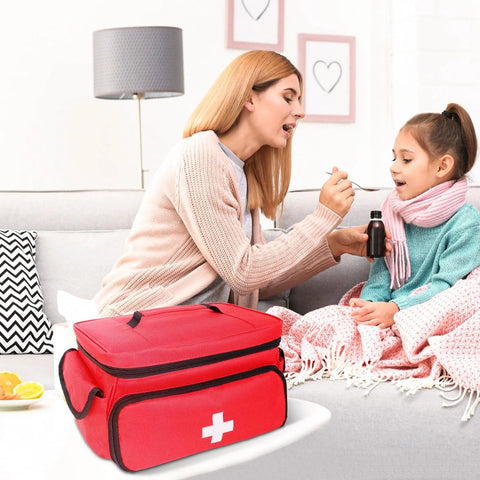 Mother and child with Red First Aid Bag Portable Medical Kit Organizer for Car Travel Office Outdoor shown in foreground.