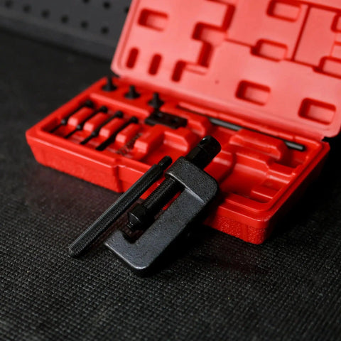 Pro Grade Chain Breaker Tool Kit With Storage Case, 13 Piece Rivet And Roller Chain Link Removal Set For Motorcycle, Bike, And ATV Chains From Size 35 To 630, Includes Master Link Press Tool And Easy Install, laid out in a red case on a table.