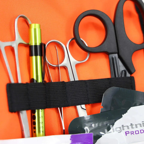 Close-up of tools inside Value Compact Medic First Responder Trauma Bag With Basic Fill Kit For EMS And EMTs Orange Stocked Bag