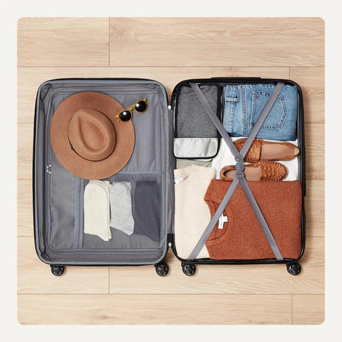 Open Big 30 Inch Hardside Checked Luggage With Four Spinner Wheels showing organized packing with clothes and accessories inside.