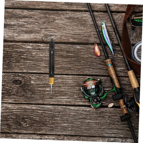 Fishing setup with rods, reels, and Stainless Steel Detacher Tool For Quick Release And Deep Hook Removal on wooden surface