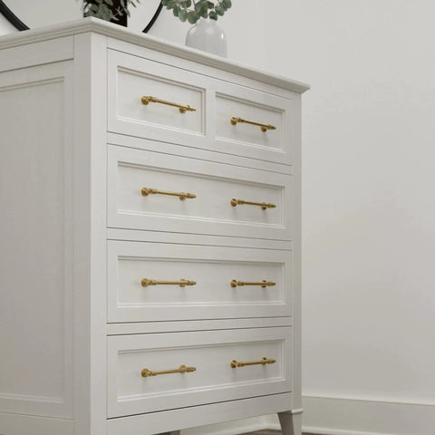 White dresser with Adjustable Drawer Pulls 5 Pack in Champagne Bronze with Fluted Edge for kitchen cabinets and furniture.