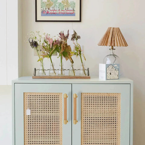 Modern Mid Century Brass And Wood Cabinet Pulls 3 Inch Center To Center Four Pack installed on rattan-style cabinet doors