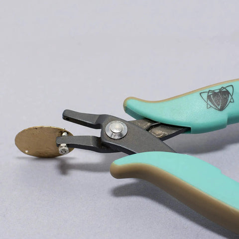 Metal Hole Punch Pliers With Gauge Guard for 22 gauge sheet metal shown punching hole in brass for jewelry making