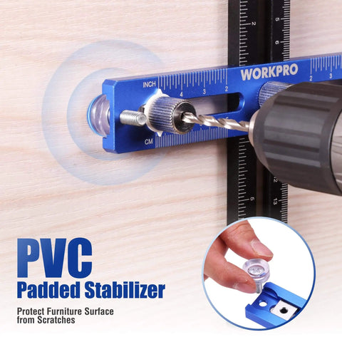 Close-up of aluminum cabinet hardware jig with 4mm drill guide, showing precision drilling on wood with PVC padded stabilizer.