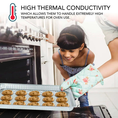Girl placing cookies on Aluminum Foil Trays 15 Pack Disposable Bakeware 16 Inch By 11 Inch Nonstick in oven for baking