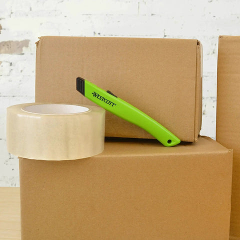 Ceramic Safety Box Cutter With Retractable Blade For Easy Large Box Opening shown with boxes and tape