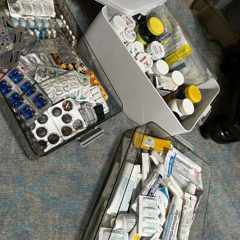 Open Four Tier Portable Medicine Storage Box Organizer with Handle showing pills and ointments, ideal for home travel first aid.