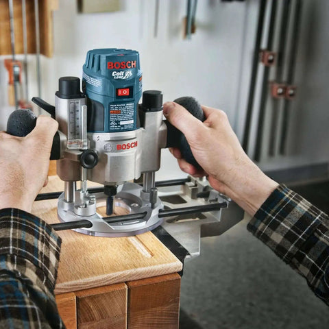 Person using Bosch router with 15 Piece Micrograin Carbide Tipped Wood Router Bit Set Universally Compatible For DIYers Finishing