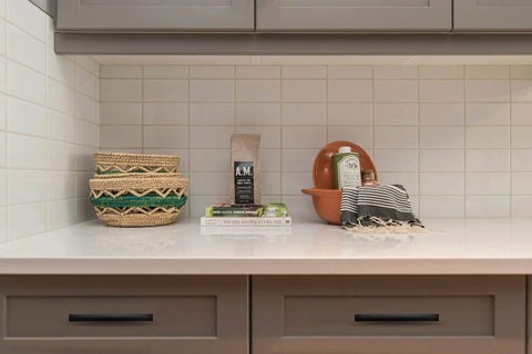 Modern kitchen counter with decor items and 30 Pack Curved Cabinet Pulls Matte Black Arch Kitchen Drawer Handles