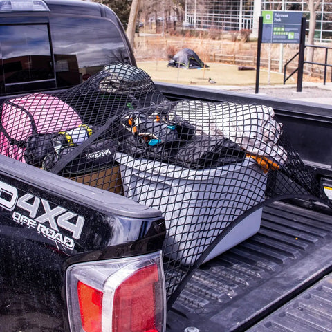Elastic Cargo Net For Truck Bed And SUV Keeps Lightweight Loads In Place Without Tying Simple Mesh Organizer Fits All Trucks Vans ATVs UTVs SUVs From 4x4 To 7x7 Feet Black securing various items in truck bed.