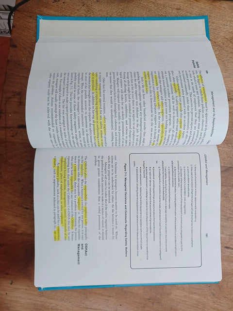 Book: Occupational Safety Management and Engineering, Amazon, blue cover, open pages with highlighted text.
