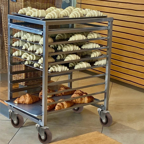 Stainless steel bakery cart with croissant trays on four 4-in x 1.5-in caster wheels