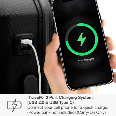 Person charging phone using Pagosa Hardside Carry-On Luggage USB port, showing indestructible polypropylene shell, 22-inch size, black.