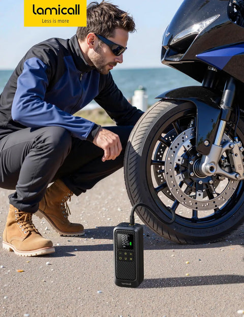 Fast Tire Inflator Portable Air Pump With Digital Gauge And LED Light 150 PSI Electric Tire Pump For Car And Motorcycle 5x Faster Inflation in use beside a motorcycle.