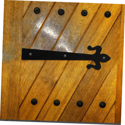 Wooden door with decorative iron strap hinge, showcasing heavy duty garage and cabinet door hinges for home and mobile doors.