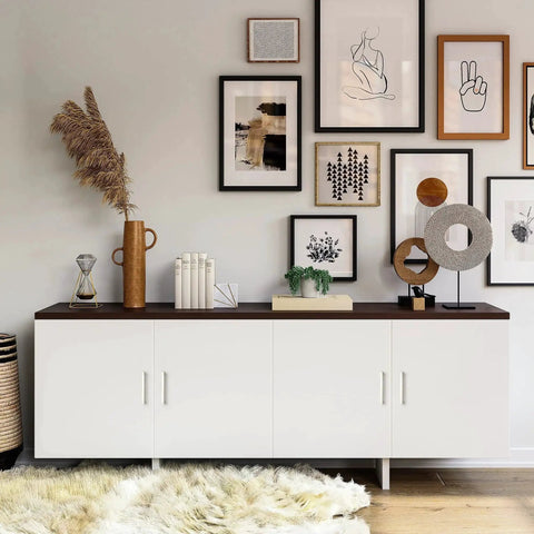 Modern living room with white cabinet showcasing framed art and decorative items on a dark countertop.