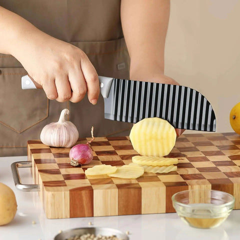 Person using Crinkle Cutter Wave For Veggies And Fries With Stainless Steel Blade And Rubber Handle Dishwasher Safe Brown Perfect For French Fries Cucumbers Carrots Potatoes And More OLULU on potatoes