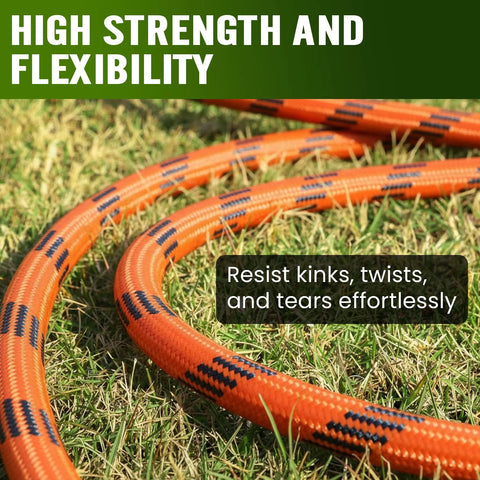 Garden hoses, orange braided, coiled on grass in a sunny yard