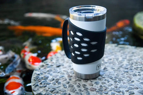 Protective Silicone Tumbler Sleeve With Handle for 20 Oz Stainless Steel Mugs near pond with koi fish