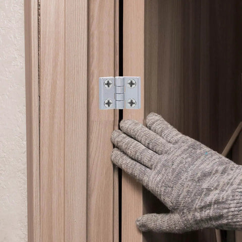 Person installing Mini Folding Hinges for Small Cabinets and Wooden Boxes 4 Pack Zinc Alloy 180 Degree Black Uxcell 43mm by 58mm 7mm Thick Adjustable on cabinet