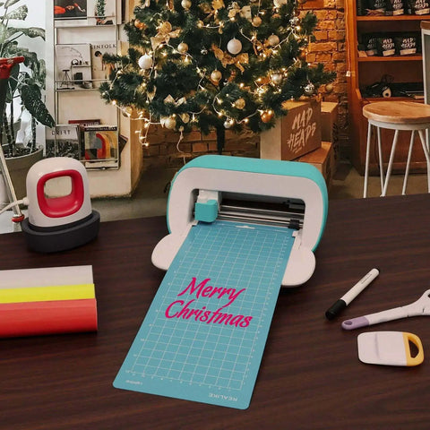 Versatile Cutting Mats For Cricut Joy 4.5 By 12 And 4.5 By 6.5 Inch 6 Pack Including Standard Grip Light Grip And Strong Grip Mats With Adhesive Backing For Joy Accessories And Creative Projects on cutting machine displaying 'Merry Christmas' text.