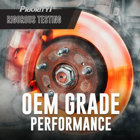 Front brake rotor and caliper assembly; orange rotor with rusted hub