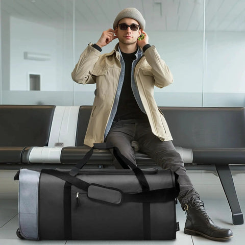 Traveler sitting behind a Foldable Rolling Duffel Bag With Wheels For Travel And Sports 100L Large Capacity Lightweight Duffel