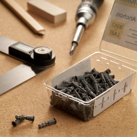 Light Duty Drywall Anchors Kit for Hollow Walls with Ribbed Plastic Anchors for Secure Picture Frames Artwork and Light Duty Mounts Simple Install Prevents Screw Pullout Great for Home Decor Qualihome, shown with tools and packaging on a wooden surface