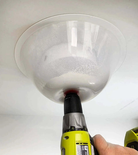 Mess Free RemGrit Blu Mol Collapsible Dust Bowl For Hole Saws And Recessed Light Installations fitted on drill during use
