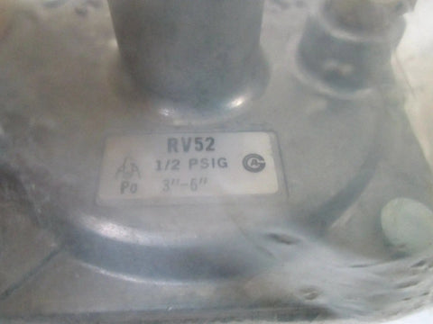 Close-up of Reliable Gas Regulator RV52 Half PSIG for precise gas pressure control with 1/2 inch inlet printed on device label.