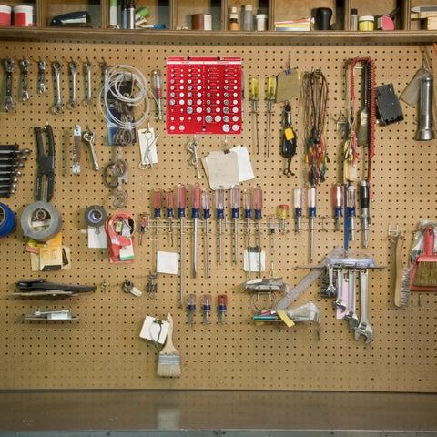 34 Bit Nut And Bolt Thread Checker Kit With 19 Standard And 15 Metric Sizes, Pro Grade, Wall Mounted And Hand Held Thread Gauge Sizing Tool, Nut And Bolt Chart, 8.07 Inch Red displayed on a tool wall with various hand tools.