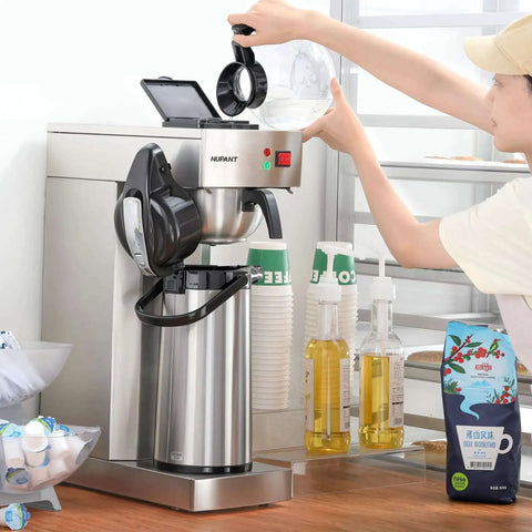 Person operating Commercial Airpot Coffee Brewer With 2.2L 74oz Thermal Carafe Stainless Steel Pour Over Coffee Machine 24 Hour Heat 120V 1450W Dispenser For Cafe Restaurant Cafeteria