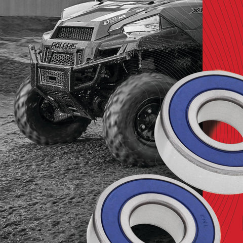 Wheel Bearing Kit For Honda Replacement With 2 ABEC 3 High Speed Bearings And Rubber Sealed Seals Type TC Double Chevron SR1 2 Grease For Beefed Up Rust And Dirt Protection, depicted near an all-terrain vehicle