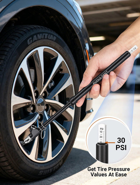 EVOULTES heavy-duty tire pressure gauge held in hand beside a car tire, black metal body, 10–150 PSI range