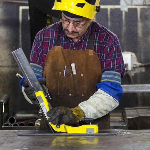 Worker using Pivot Angle 200 Adjustable Welding Magnet on metal piece, showing multi-angle magnetic holder in action.
